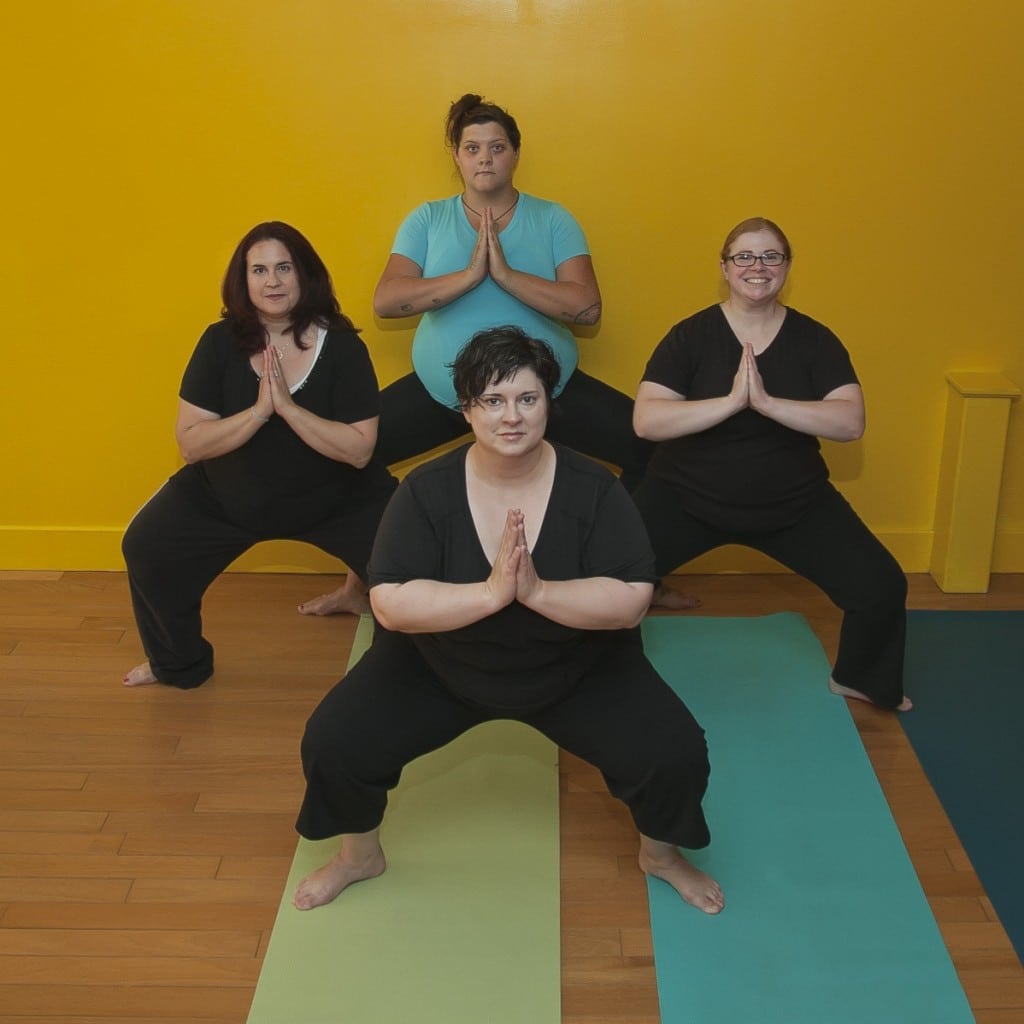 Yoga 2eXceL students in Buddha  Squat.