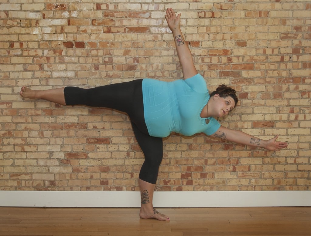 Connie Bonnie Perkins in half moon pose.