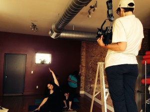 Photographer Roxanne Frith directs yoga students into poses for Just B Yoga photo shoot.