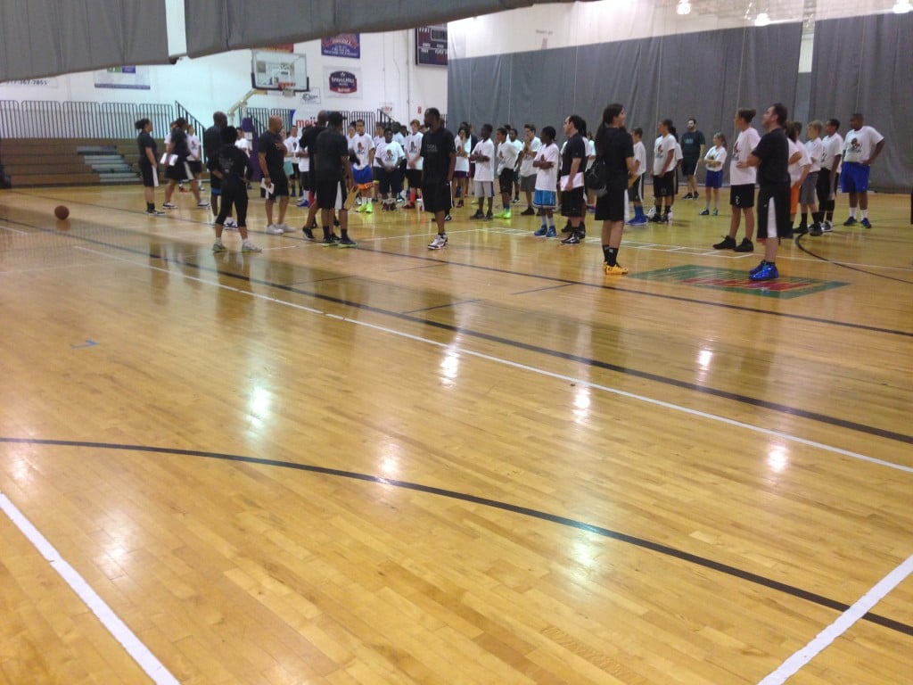 Players line up for the yoga at the Mateen Cleaves 1 Goal 1 Passion Basketball Camp.